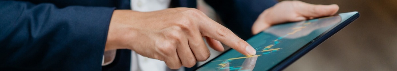 close-up of a hand tapping a tablet